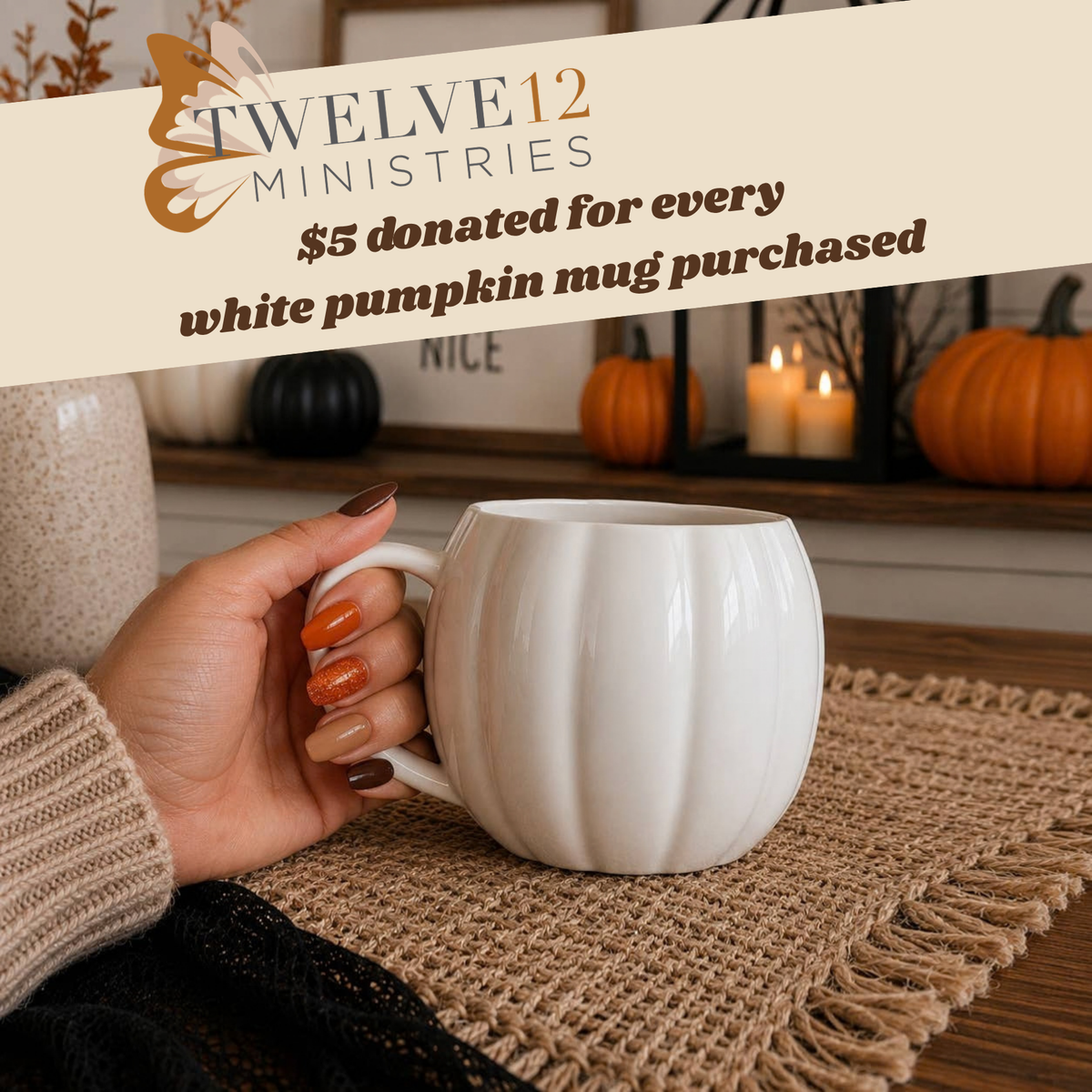 A hand holds a white ribbed pumpkin-shaped ceramic mug on a burlap placemat in a cozy fall setting. A banner at the top reads 'TWELVE12 MINISTRIES $5 donated for every white pumpkin mug purchased'.