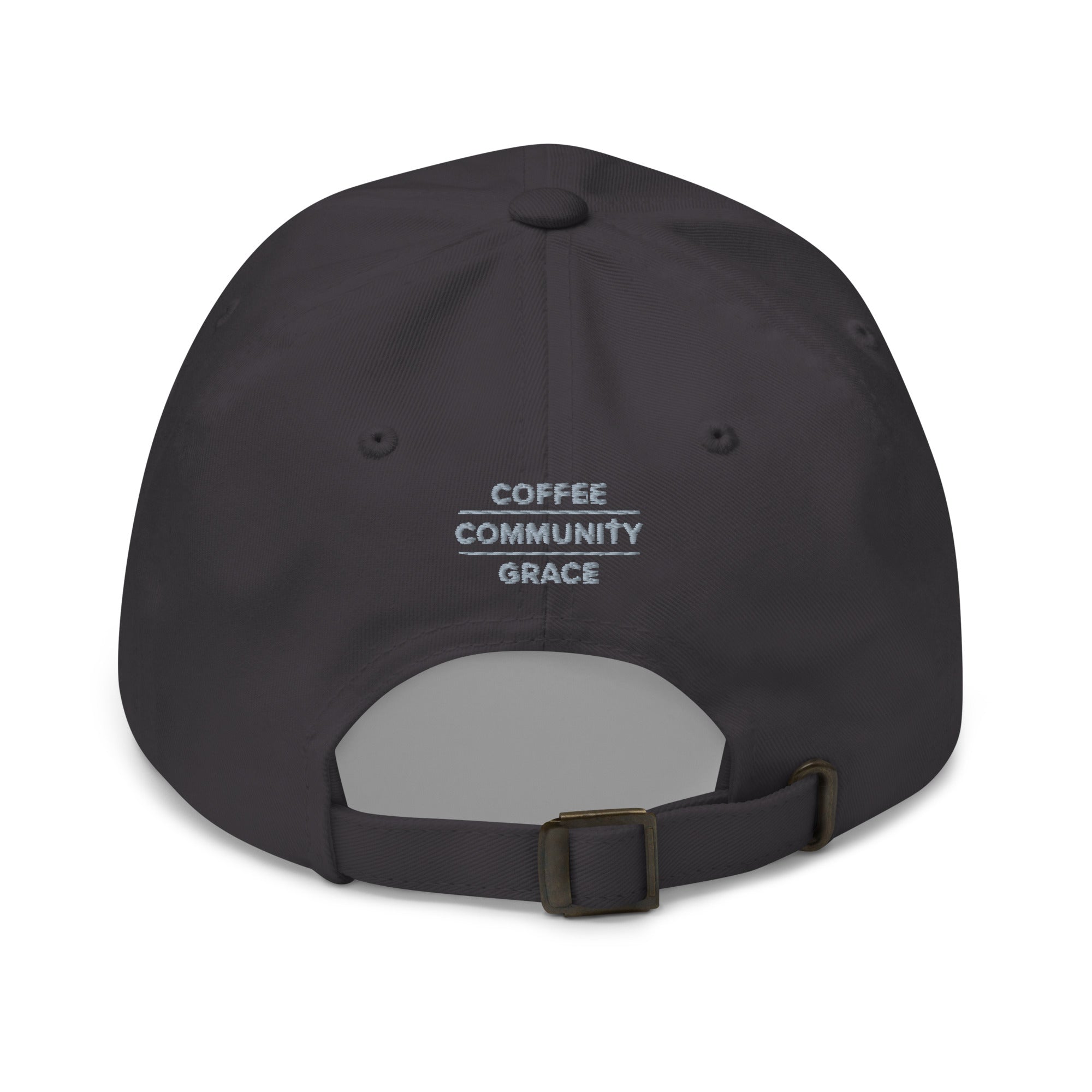 A dark charcoal gray baseball cap shown from the back, featuring the text 'COFFEE COMMUNITY GRACE' printed in white on the back panel. The cap has an adjustable dark strap with a metal buckle.