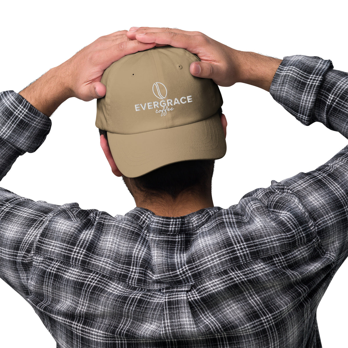 Person wearing a beige cap with 'EverGrace Coffee' text, against a white background